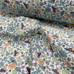 Voile di cotone Bio, Bianco con Fiori Celesti, Arancioni e Gialli e Foglie Verdi