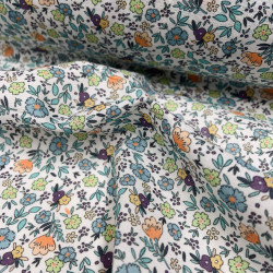Voile di cotone Bio, Bianco con Fiori Celesti, Arancioni e Gialli e Foglie Verdi