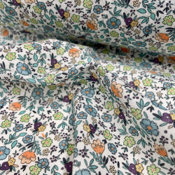 Voile di cotone Bio, Bianco con Fiori Celesti, Arancioni e Gialli e Foglie Verdi