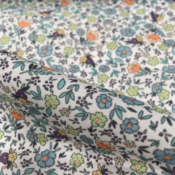 Voile di cotone Bio, Bianco con Fiori Celesti, Arancioni e Gialli e Foglie Verdi