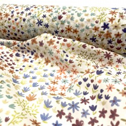 Plumeti Cotton con ricamo in rilevo , base Bianca con fiorellini colorati
