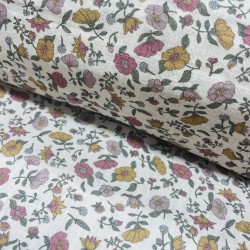 Cotone con stampa di fiori ocra e rosa.