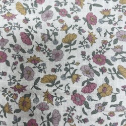 Cotone con stampa di fiori ocra e rosa.
