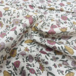 Cotone con stampa di fiori ocra e rosa.