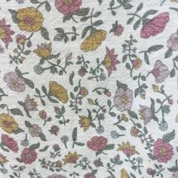 Cotone con stampa di fiori ocra e rosa.