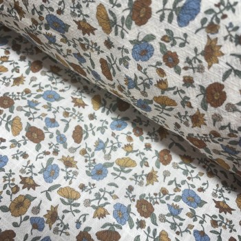 Cotone con stampa di fiori ocra e turchesi.
