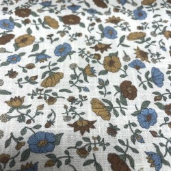 Cotone con stampa di fiori ocra e turchesi.