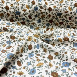 Cotone con stampa di fiori ocra e turchesi.