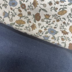 Cotone con stampa di fiori ocra e turchesi.